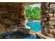Unique pool grotto with stone design, creating a cozy and secluded spot with a pool view at 2421 Acanthus Dr, Wake Forest, NC 27587