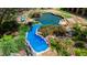 Unique slide and landscaping features, with a beautiful rock-lined pool in the background at 2421 Acanthus Dr, Wake Forest, NC 27587