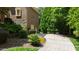 Picturesque home surrounded by mature trees and meticulously maintained landscape at 2421 Acanthus Dr, Wake Forest, NC 27587