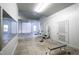 Bright workout room inside the garage equipped with gym equipment and a large mirror for training at 2421 Acanthus Dr, Wake Forest, NC 27587