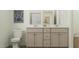 Stylish bathroom with a double sink vanity, neutral cabinetry, and a clean, modern design at 244 St Andrews Dr, Zebulon, NC 27597