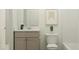 Cozy bathroom features a combo shower-tub, and modern fixtures, offering functionality and a comfortable space at 244 St Andrews Dr, Zebulon, NC 27597
