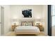 Relaxing bedroom with calm design elements, cozy bedding, woven nightstands and natural light at 244 St Andrews Dr, Zebulon, NC 27597