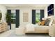Bright bedroom with plush bed, stylish décor, and natural light streaming through the windows at 244 St Andrews Dr, Zebulon, NC 27597