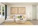 Bright living room features a comfortable sectional sofa, neutral tones, and natural light, ideal for relaxation at 244 St Andrews Dr, Zebulon, NC 27597