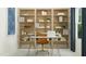 Stylish home office with bookshelves, natural light, and neutral tones, perfect for productivity at 244 St Andrews Dr, Zebulon, NC 27597