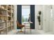 Home office features natural light, decor, bookshelves, and neutral tones, making it ideal for productivity at 244 St Andrews Dr, Zebulon, NC 27597