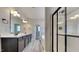 Bathroom showcasing double vanity, large mirror, and glass shower at 257 Swann Trl, Clayton, NC 27527