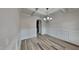 Elegant dining room showcases a stylish chandelier and wainscoting at 257 Swann Trl, Clayton, NC 27527