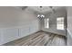 Bright dining room boasts coffered ceilings, wood floors, and elegant wainscoting at 257 Swann Trl, Clayton, NC 27527
