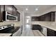 Well-equipped kitchen boasts granite countertops and stainless steel appliances at 257 Swann Trl, Clayton, NC 27527