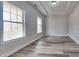 Bright living room features wood floors, recessed lighting, and natural light at 257 Swann Trl, Clayton, NC 27527