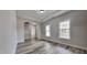 Inviting living room featuring arched entryways, wood floors, and natural light at 257 Swann Trl, Clayton, NC 27527