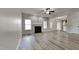 Spacious living room features a cozy fireplace and wood floors at 257 Swann Trl, Clayton, NC 27527