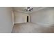 Spacious main bedroom featuring a ceiling fan and neutral carpeting at 257 Swann Trl, Clayton, NC 27527
