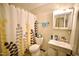 Cozy bathroom with a shower/tub combo, a vanity with sink, and a medicine cabinet at 2726 Thelma St, Durham, NC 27704