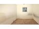 This carpeted bedroom features a window bringing natural light into the living space at 2726 Thelma St, Durham, NC 27704