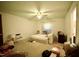 Bedroom with a comfortable air mattress, ceiling fan, and natural light at 2726 Thelma St, Durham, NC 27704