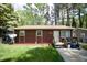 Charming one-story home with wood siding, a well-manicured lawn, and a welcoming front entrance at 2726 Thelma St, Durham, NC 27704
