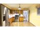 Spacious kitchen features stainless steel appliances, wooden cabinets, and a stainless steel sink at 2726 Thelma St, Durham, NC 27704
