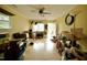 A spacious living room with hardwood floors, a ceiling fan, and an open doorway at 2726 Thelma St, Durham, NC 27704