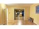 Open living room showcasing hardwood floors and an inviting view into the updated kitchen at 2726 Thelma St, Durham, NC 27704