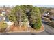 Aerial view showing the property's proximity to other houses and surrounding mature trees at 300 Pate St, Apex, NC 27502