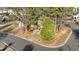 Aerial view of a landscaped yard with a fire hydrant on the corner and mature trees around the house at 300 Pate St, Apex, NC 27502