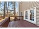 A view from the back deck shows access to the house and a wooded backyard at 300 Pate St, Apex, NC 27502