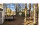 Wooden deck on the back of the house overlooks a wooded area, providing a peaceful retreat at 300 Pate St, Apex, NC 27502