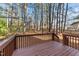 A backyard deck overlooks a wooded backyard at 300 Pate St, Apex, NC 27502