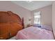 Bedroom featuring vintage wooden furniture and a window that allows natural light at 300 Pate St, Apex, NC 27502