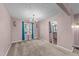 Traditional dining room featuring a chandelier, window, and neutral color scheme at 300 Pate St, Apex, NC 27502