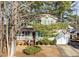 Lovely two-story house with green shutters, a covered porch, and an attached garage at 300 Pate St, Apex, NC 27502