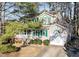 Charming home featuring green shutters, a front porch, a well-kept lawn, and an attached one-car garage at 300 Pate St, Apex, NC 27502