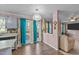A traditionally styled kitchen offers access to a wooden deck and a view to the living room at 300 Pate St, Apex, NC 27502