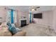 A comfortable living room features a fireplace and big windows with lots of natural light at 300 Pate St, Apex, NC 27502