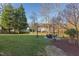 Spacious backyard with a fire pit and seating area at 3109 Doe Hill Ct, Raleigh, NC 27612
