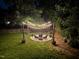 Inviting backyard patio with string lights creating a warm and festive ambiance at 3109 Doe Hill Ct, Raleigh, NC 27612