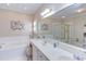 This bathroom features a soaking tub and shower with white counters at 3109 Doe Hill Ct, Raleigh, NC 27612