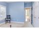 This room features blue walls and a large window with shutters at 3109 Doe Hill Ct, Raleigh, NC 27612