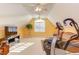 Spacious bonus room with a flat-screen TV and exercise equipment, ideal for entertainment and fitness at 3109 Doe Hill Ct, Raleigh, NC 27612