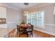 Dining room with a round table, hardwood floors, lots of natural light, and a plant at 3109 Doe Hill Ct, Raleigh, NC 27612