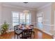 Dining room featuring a round table, hardwood floors, a plant, and lots of natural light at 3109 Doe Hill Ct, Raleigh, NC 27612