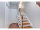 Spacious entryway boasting hardwood stairs and a convenient coat closet at 3109 Doe Hill Ct, Raleigh, NC 27612