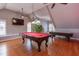 A game room showcases the billiards table and an air hockey table at 3109 Doe Hill Ct, Raleigh, NC 27612