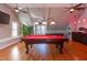 Large game room with a billiards table, ceiling fans, and light fixtures at 3109 Doe Hill Ct, Raleigh, NC 27612