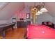 Open concept game room featuring a wet bar, billiards, and air hockey at 3109 Doe Hill Ct, Raleigh, NC 27612
