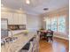 Eat-in kitchen featuring a breakfast nook with hardwood floors and stainless steel appliances at 3109 Doe Hill Ct, Raleigh, NC 27612