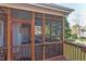 Screened-in porch with outdoor furniture at 3109 Doe Hill Ct, Raleigh, NC 27612